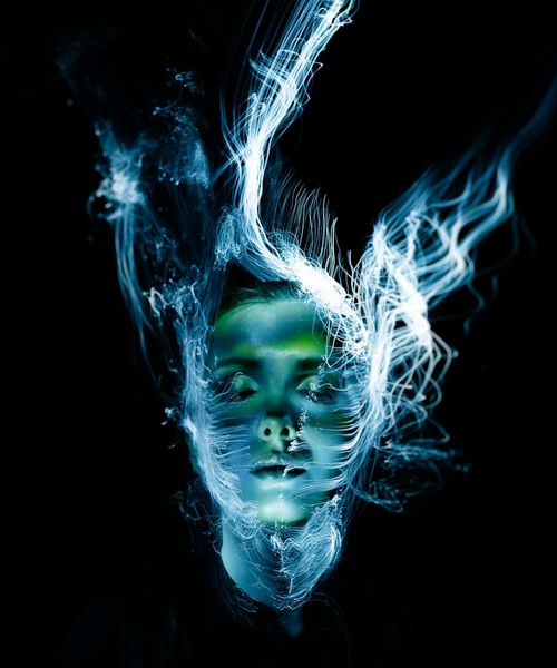 Silhouette of a person in a peaceful state with glowing lines representing energy flow.